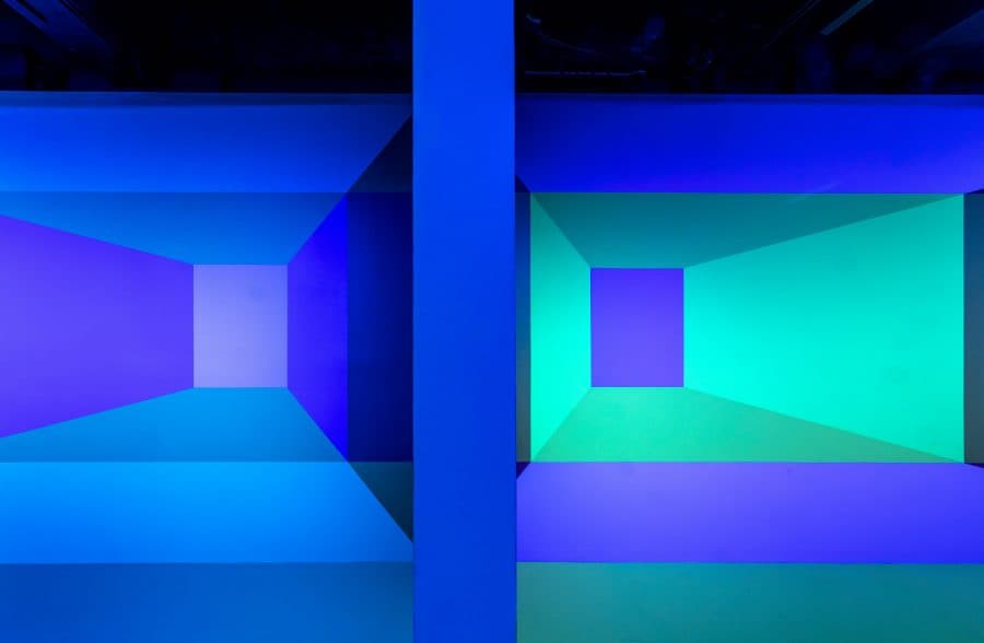 Studio with light projected onto walls in a different color scheme