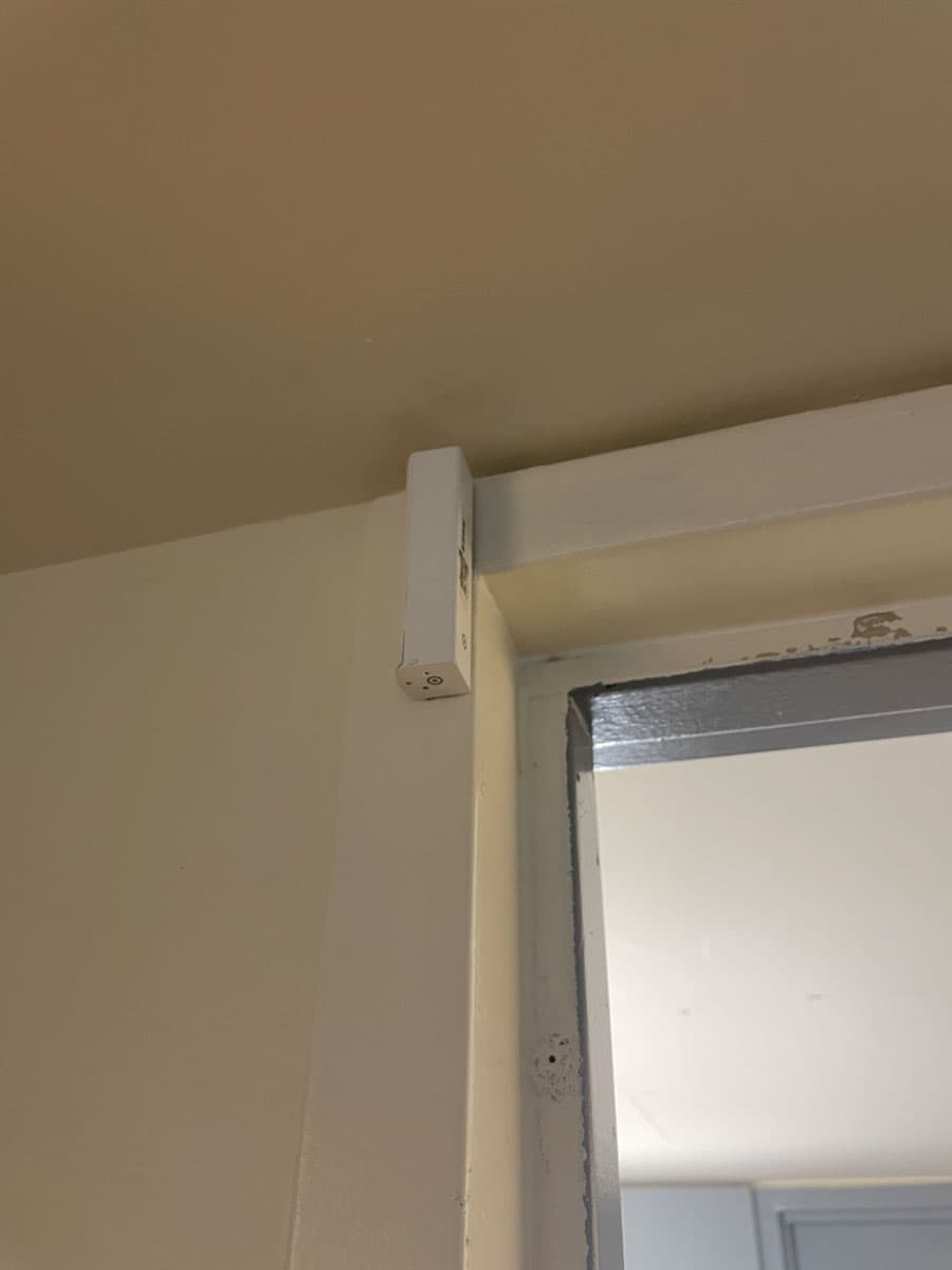 Located at the entrance to my dorm. Detects door opening and closing.